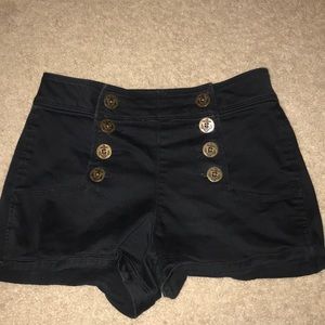 High waisted black shorts.